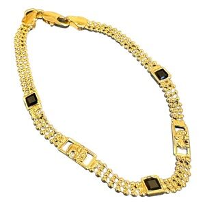 Golden pulcera with black zirconia pebbles (18k laminated gold)